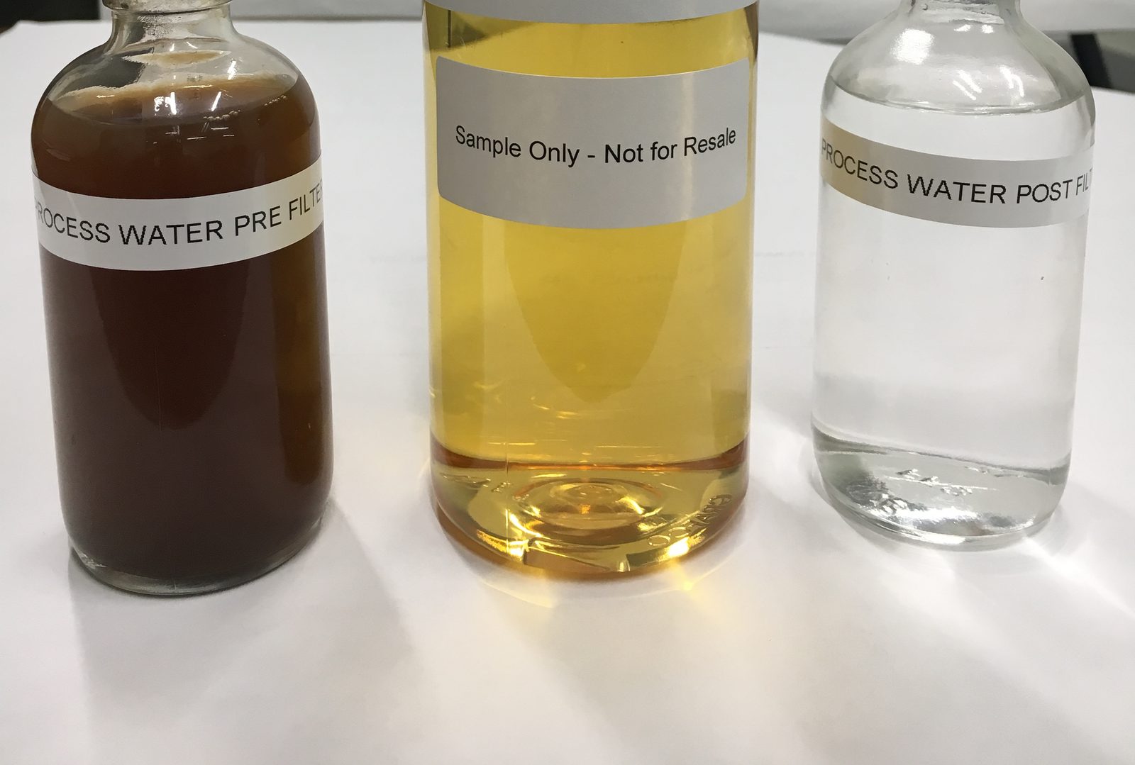 Process water samples before and after filtering